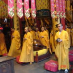 Young buddhist monks praying for peace